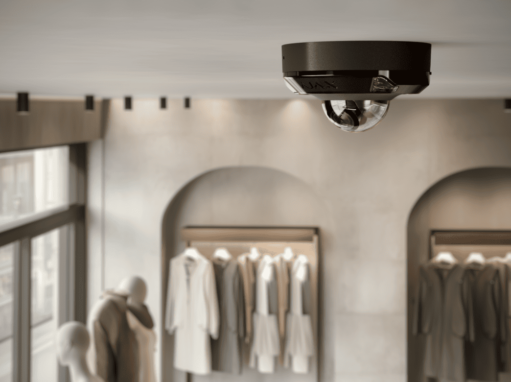 black ajax dome camera in clothing store
